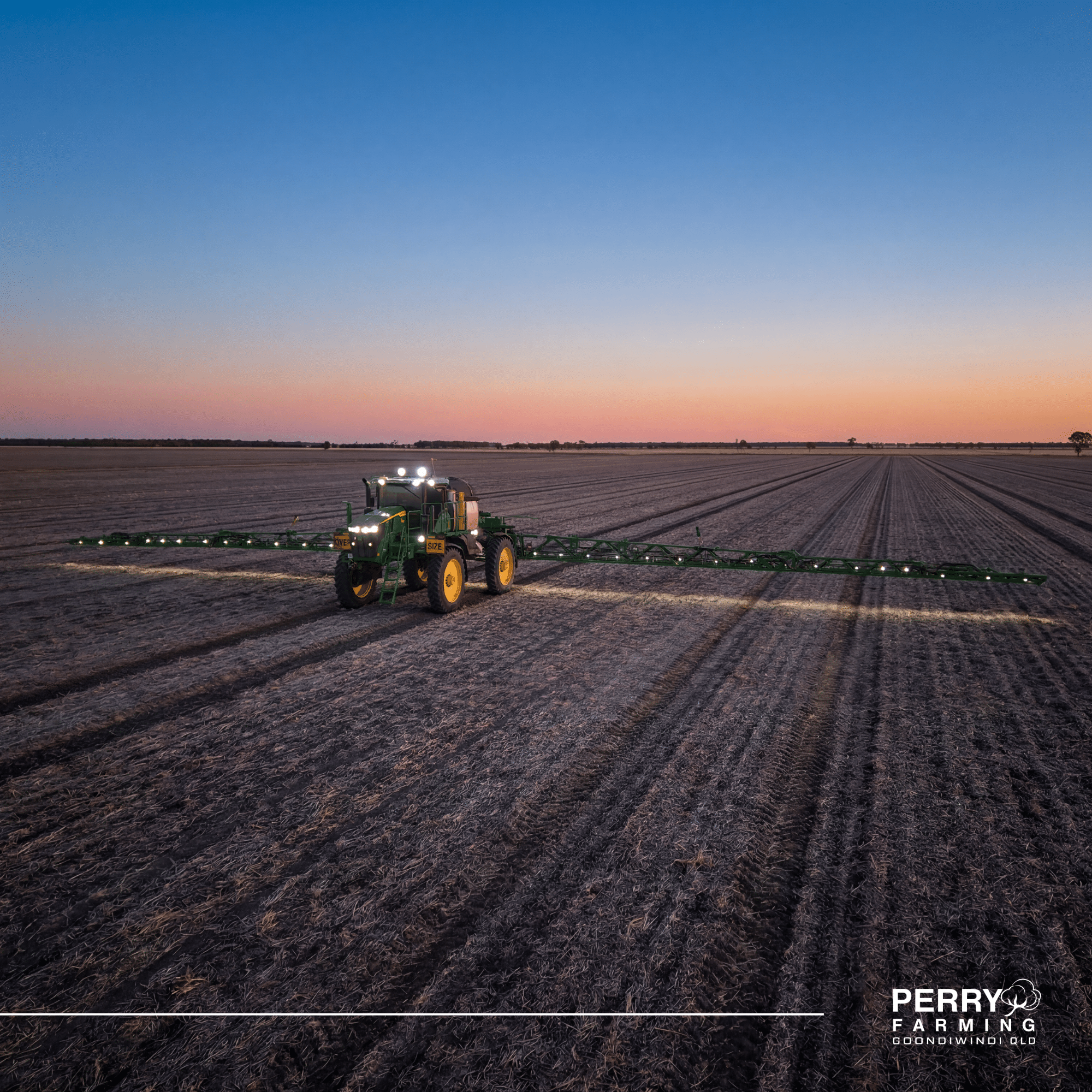 Tractor farming equipment on a wide plowed field at sunset, with a Perry Farming watermark in the bottom-right corner.